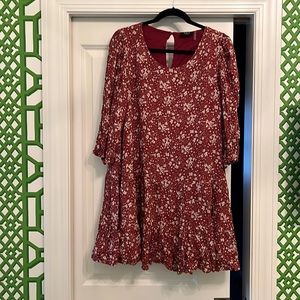 Burgundy babydoll Vici dress with white flowers. Light fabric! Never worn!